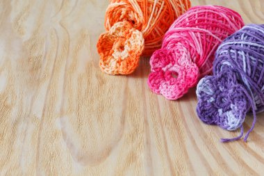 Handmade colorful crochet flowers with skein  clipart