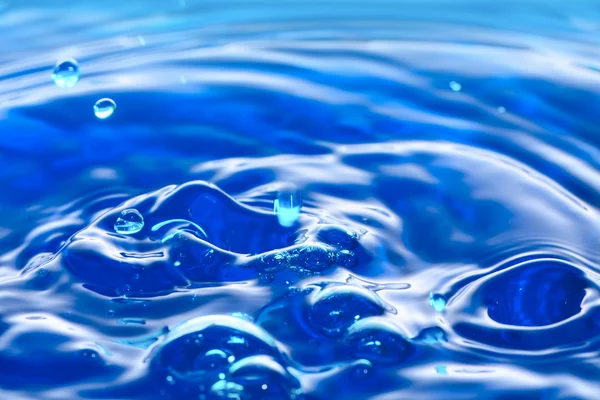 Gotita de agua azul colorida —  Fotos de Stock