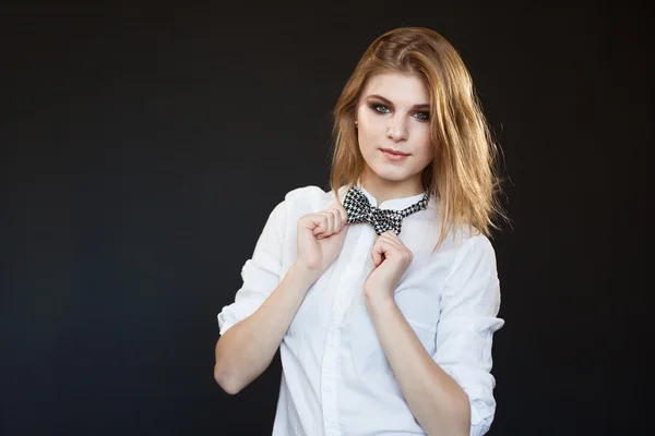 Sexy woman in a white shirt with on dark background — Stock Photo, Image