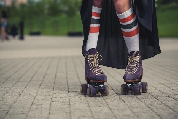 Female legs in roller skating — Stock Photo, Image