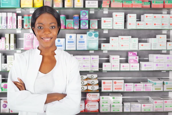 Young black pharmacist in pharmacy — Stock Photo, Image