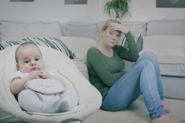 Young woman suffering from postpartum depression clipart
