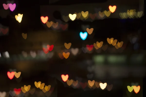 Blurry hearts on city background — Stock Photo, Image