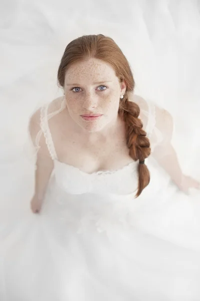 Portrait of Beautiful freckled redhead Bride