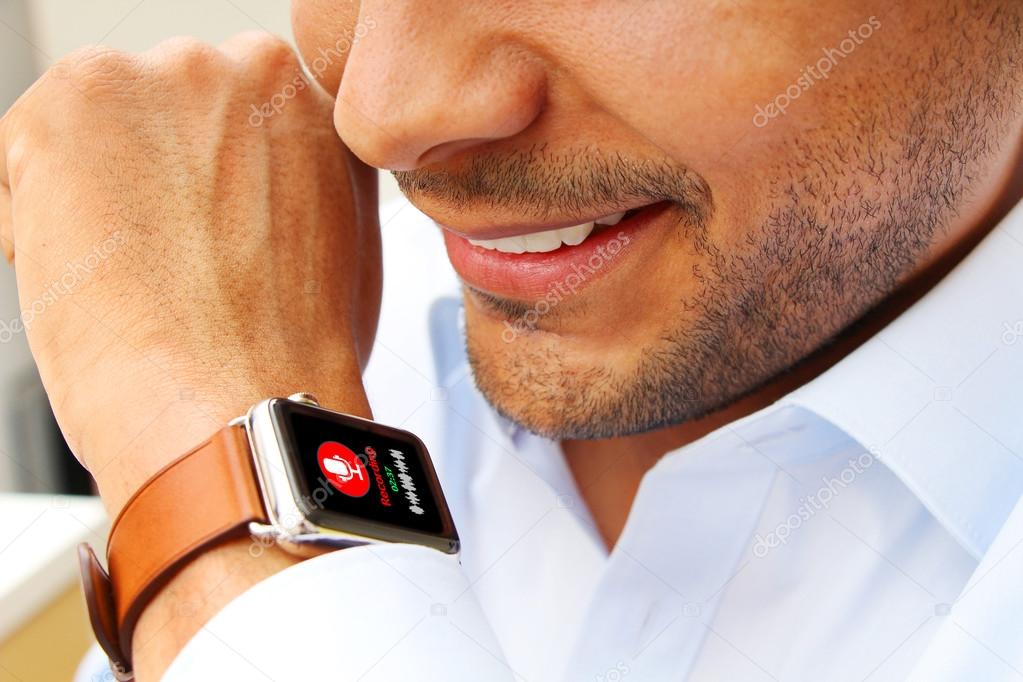 Businessman recording an audio with his smart watch