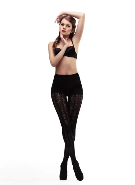 Menina sexy em meia-calça preta e sutiã — Fotografia de Stock