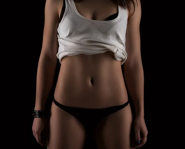 Σέξι στενη γραμμη σώμα γυναίκας. Μυώδης κοιλιά. Αθλητικών ειδών. Σκούρο πίσω — Φωτογραφία Αρχείου
