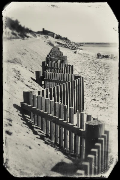 Beach fence on a beach in Eastham, MA Cape Cod, vintage look. — Stock Photo, Image