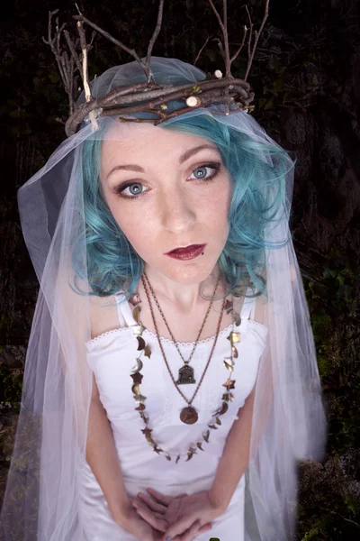 Pretty young woman with blue hair wearing crown — Stock Photo, Image