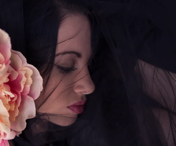 Woman with black tulle on face — Stock Photo, Image