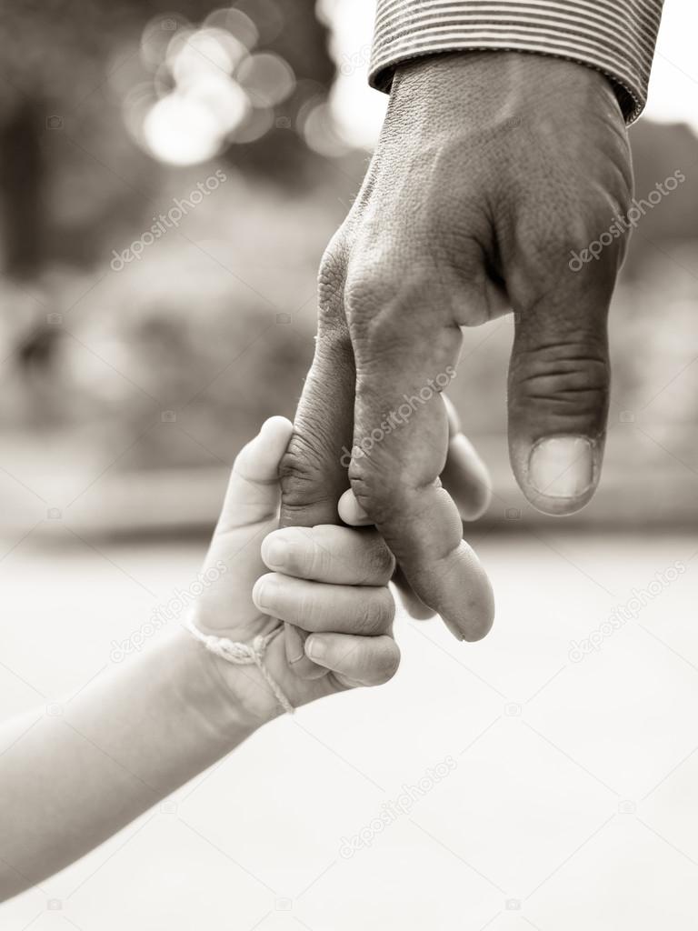 Father giving hand to a child