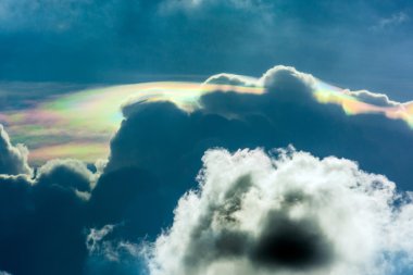 iridescent pileus cloud. iridescent pileus cloud (irisation clouds, Mother-of-Pearls clouds, rainbow clouds) The beautiful natural phenomenon. clipart