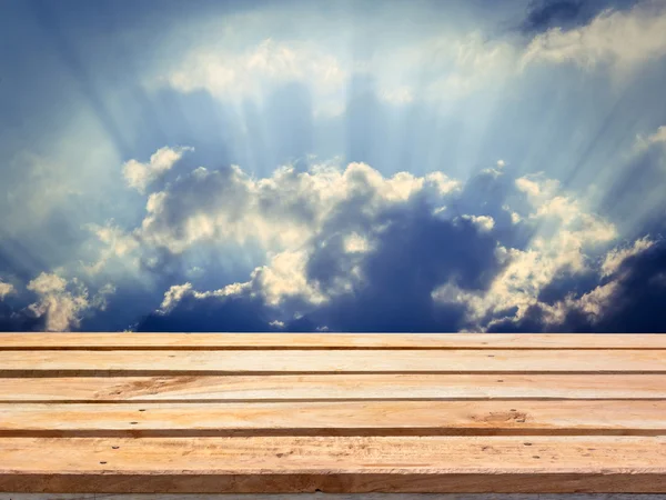 Empty wooden deck table on vintage sky background — Stock Photo, Image