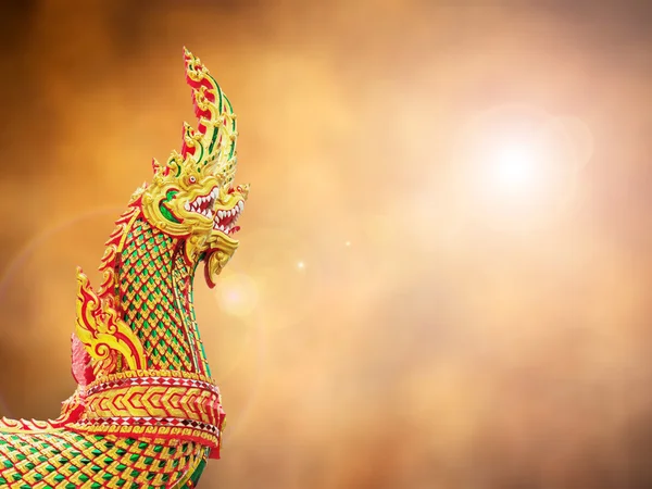 Thai dragon or king of Naga statue on retro abstract background — Stock Photo, Image