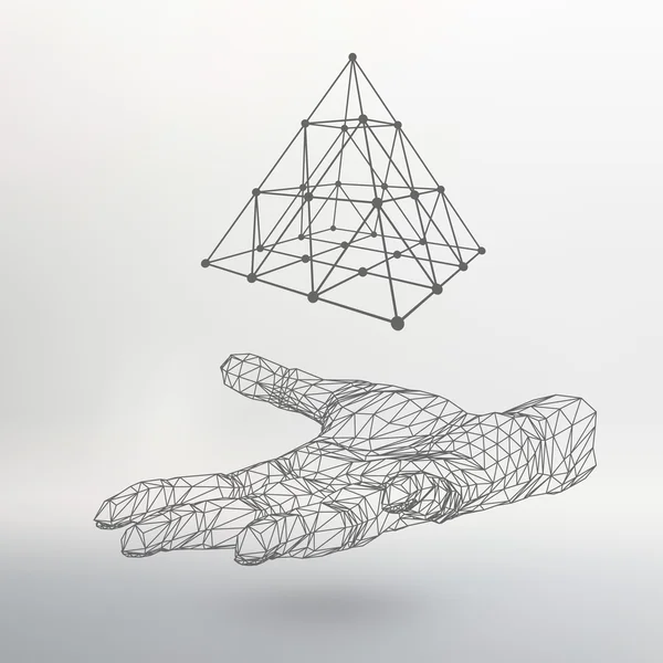 triangle pyramid on the arm. The hand holding a pyramid. Polygon triangle. Polygonal hand. The shadow of the objects in the background.