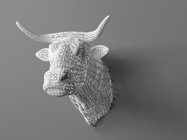 Artificial bulls head hanging on the wall. Polygonal head of a bull. Cows from the three-dimensional grid. The object of art on the wall. Volume model. Meshwork.