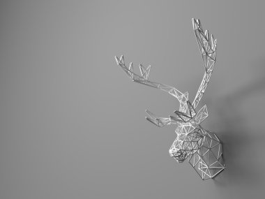 Artificial deer head hanging on the wall. Polygonal head of a deer. Deer from the three-dimensional grid. The object of art on the wall. Volume model. Meshwork.