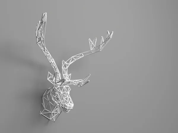 Artificial deer head hanging on the wall. Polygonal head of a deer. Deer from the three-dimensional grid. The object of art on the wall. Volume model. Meshwork. — Stock fotografie