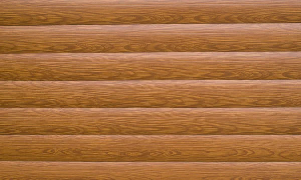 丸みを帯びた梁の木製の壁を模倣した新しい茶色のプラスチック表面が接近 — ストック写真