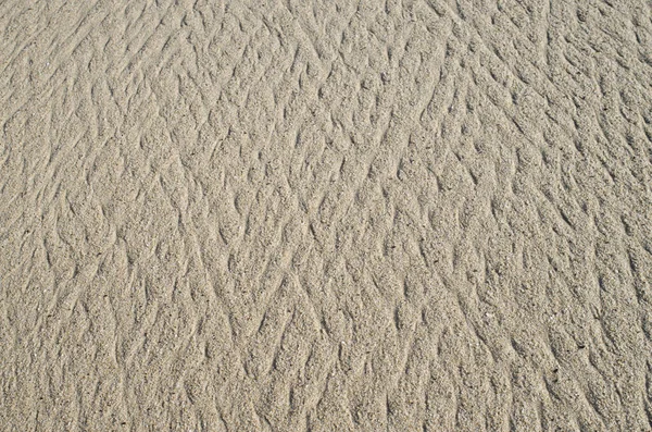 Våt Sand Med Linjer Efter Havsvågen Closeu — Stockfoto
