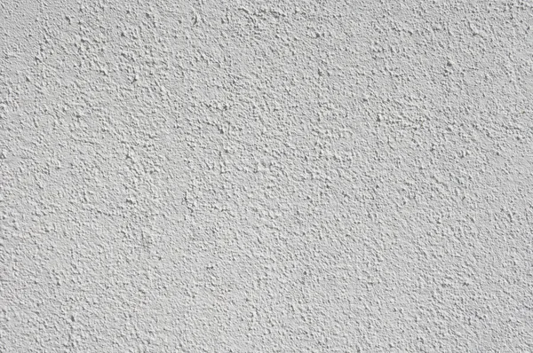 Gesso grezzo grigio chiaro su muro primo piano — Foto Stock