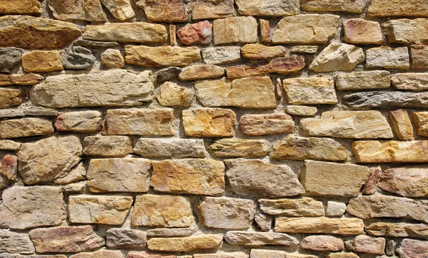 Kleurrijke stenen muur close-up — Stockfoto