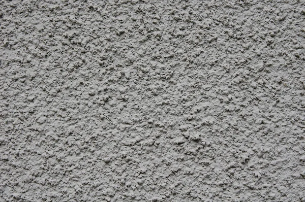 Yeso rugoso gris en primer plano de la pared — Foto de Stock