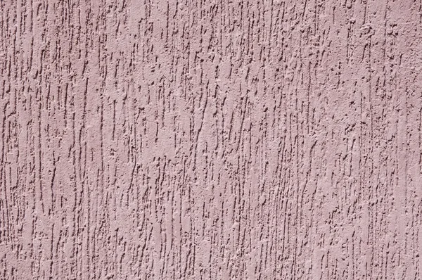 Violet relief plaster on wall closeup