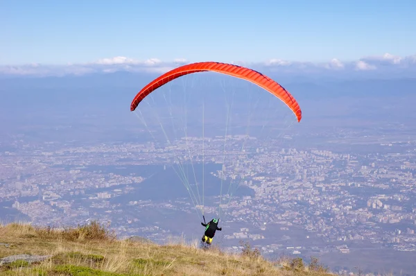 Red paraglider over city Sofia, Bulgaria — Stock Photo, Image