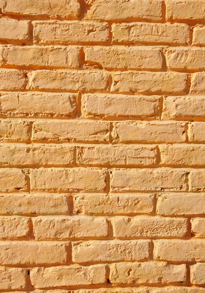 Oranje geschilderd bakstenen muur close-up — Stockfoto