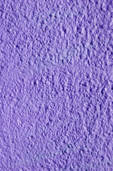 Decorative relief purple plaster on wall — Stock Photo, Image