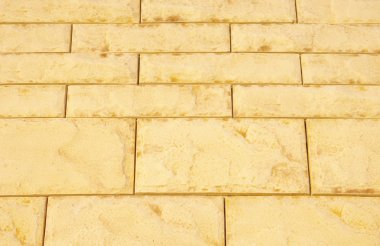 Yellow cladding tiles imitating stones clipart