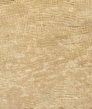 Duvarda işlenmiş taş portre  