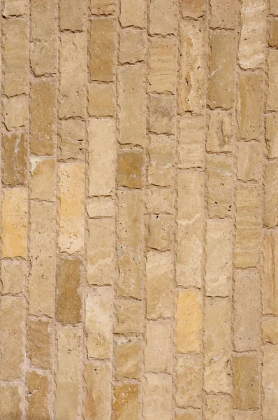 Losas verticales de piedra marrón en la pared —  Fotos de Stock