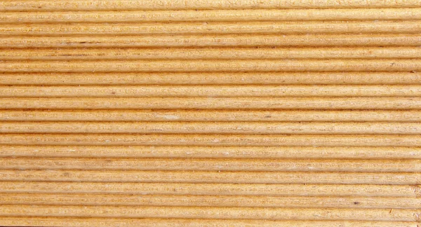 Wooden light brown grooves panel closeup — Stock Photo, Image