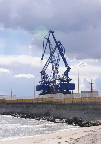 Lens flare the sun is outside cranes in port terminal — Stock Photo, Image