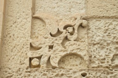 Barok yıpranmış taş, Lecce, Ital 'daki binanın ön cephesine oyulmuş süs.