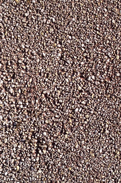 Pebble vermelho mosaico seixos parede closeup — Fotografia de Stock