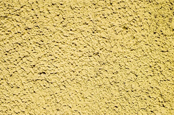 Decorative yellow relief plaster on wall — Stock Photo, Image