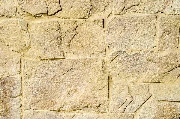 Placas de revestimiento de piedra amarilla en la pared — Foto de Stock