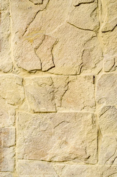 Placas de revestimento de pedra amarela na parede — Fotografia de Stock
