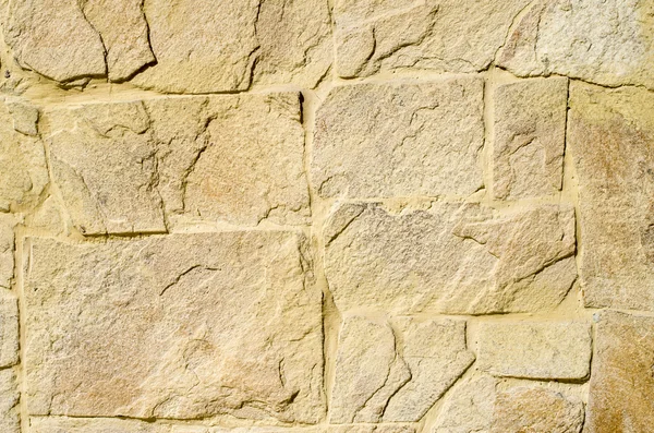 Gul sten beklädnad plattor på väggen — Stockfoto