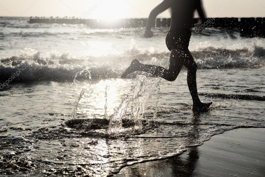 By the Sea - Boy Running on the Beach at Sunset