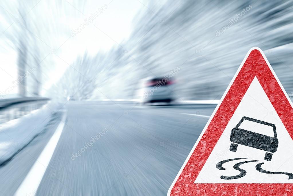 Winter Driving - Icy Road with Warning Sign