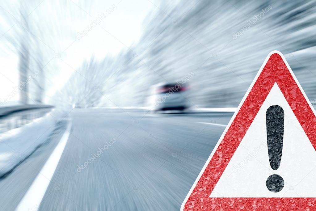 Winter Driving - Icy Road with Warning Sign