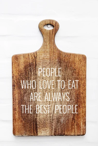 Quote PEOPLE WHO LIKE TO EAT-BEST PEOPLE  on the cutting board. — Stock Photo, Image