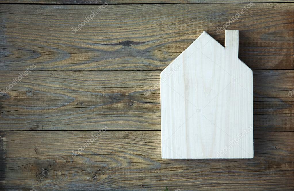 House Shaped Chalkboard sign on rustic wood Stock Photo by ©jusakas