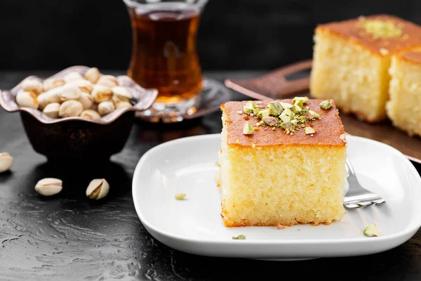 Revani - sweet semolina cake with pistachio, traditional turkish dessert