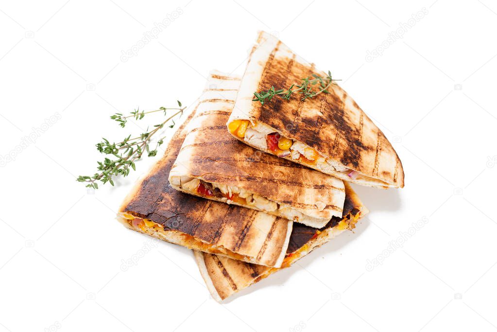 Mexican quesadilla with chicken meat,sweetcorn and pepper served with different sauces. isolated on white background.