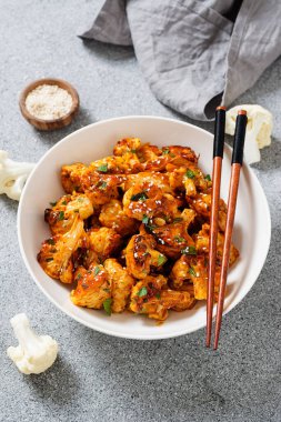 Buffalo Cauliflower . Popular Baked Cauliflower with barbeque sauce. Barbecue Cauliflower Wings . Vegan Food.	